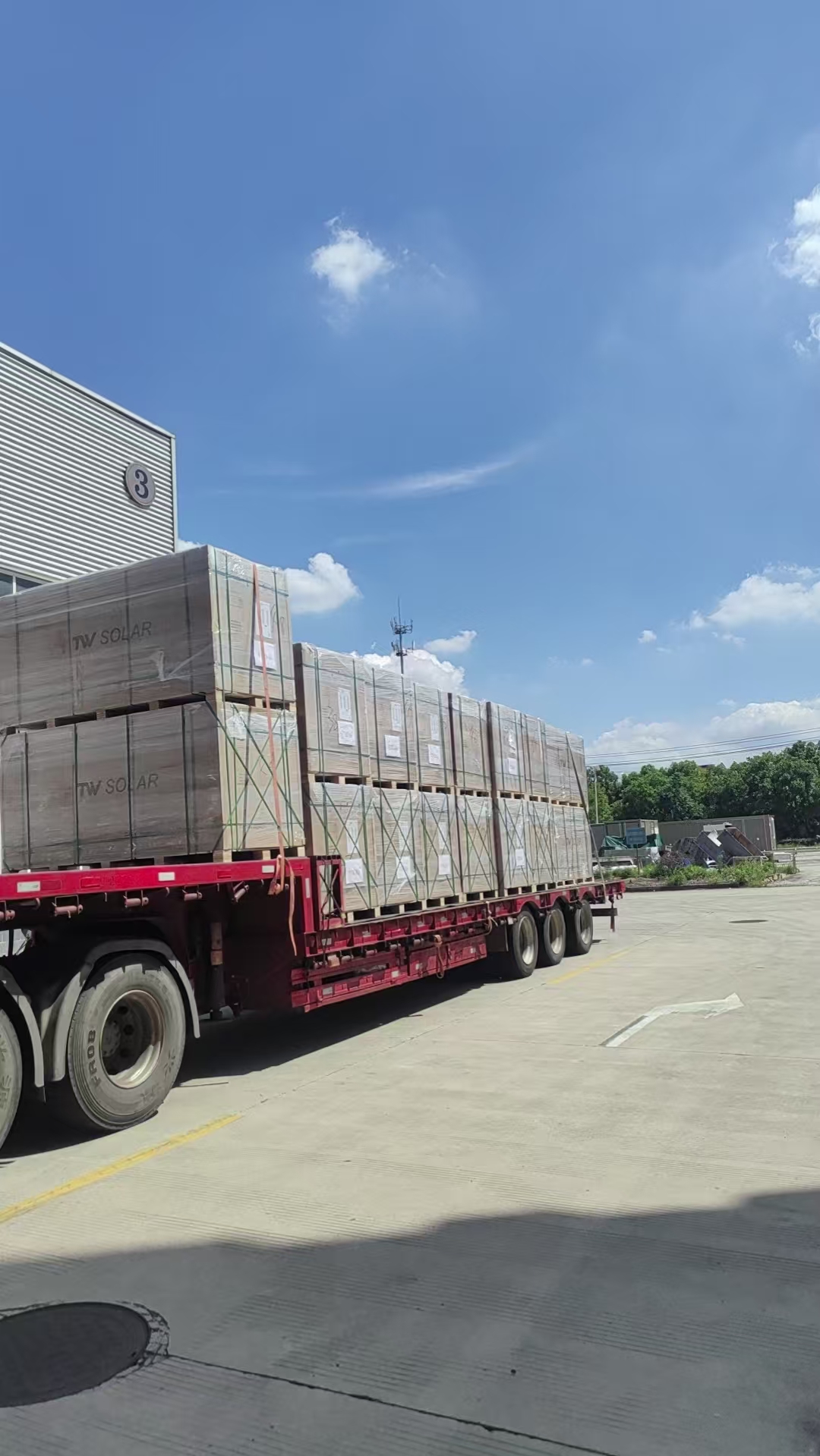 TW Solar panels stacked on flatbed truck ready for dispatch