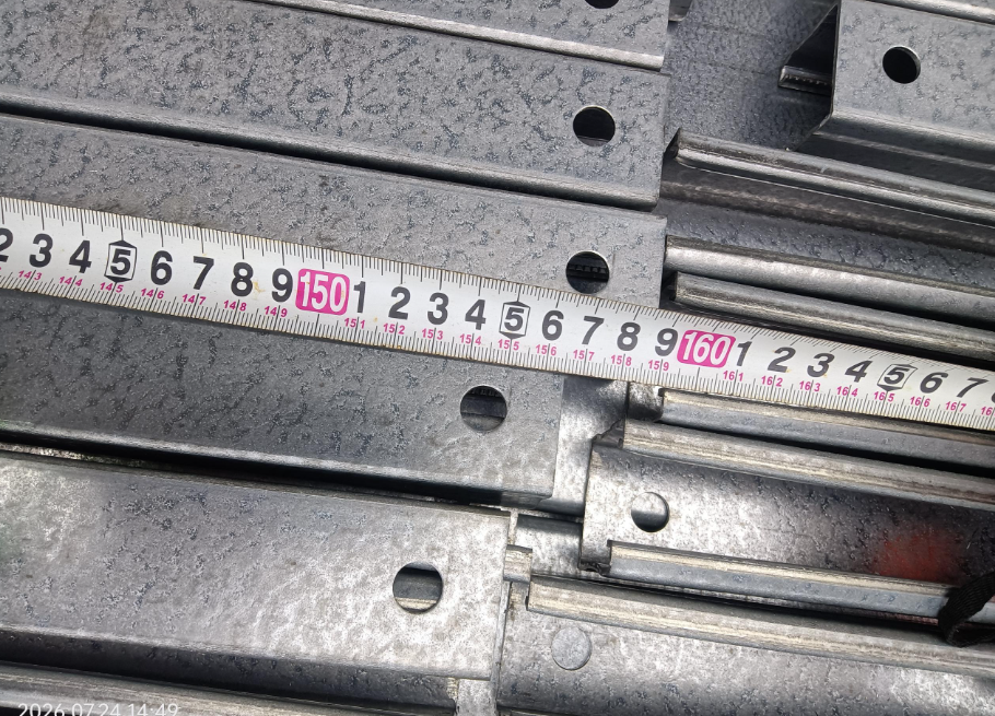 QC dimensional inspection of solar mounting rails with measuring tape